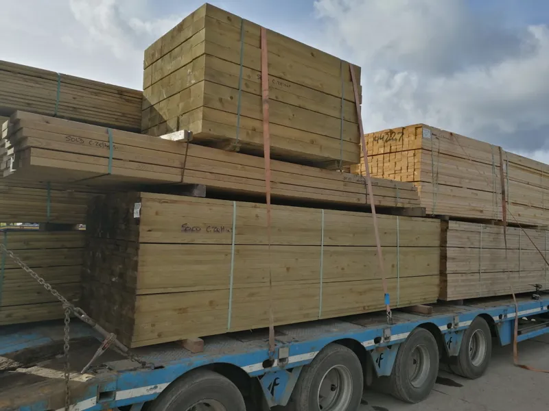 A lorry load of fresh timber arriving at the yard