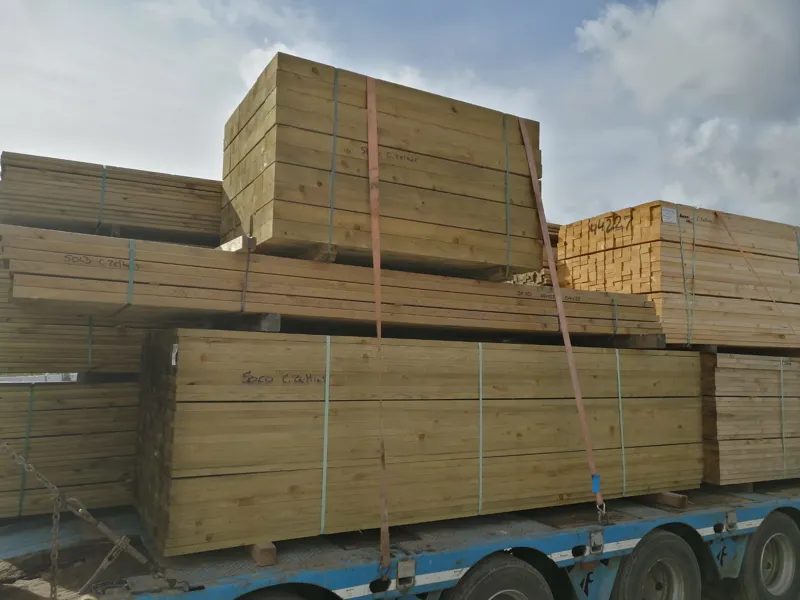 Packs of pressure-treated timber on a trailer